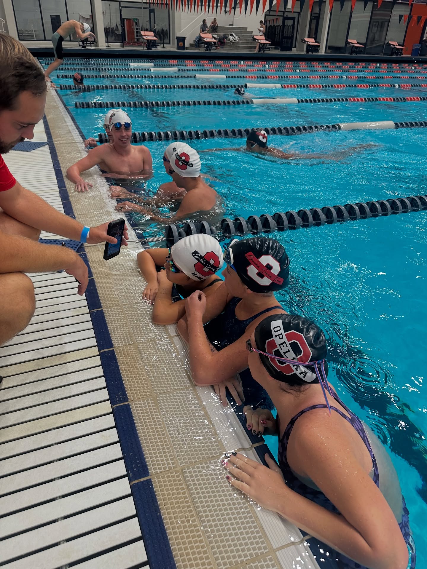 Swim meet scoreboard showing live race results